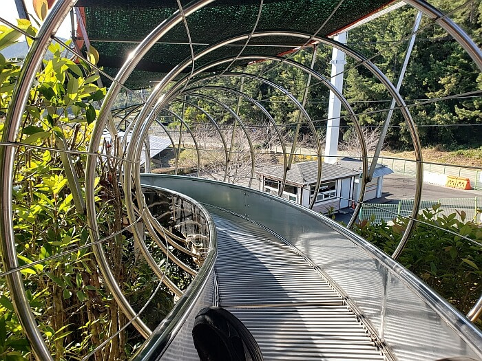 A slide made up of many metal rollers