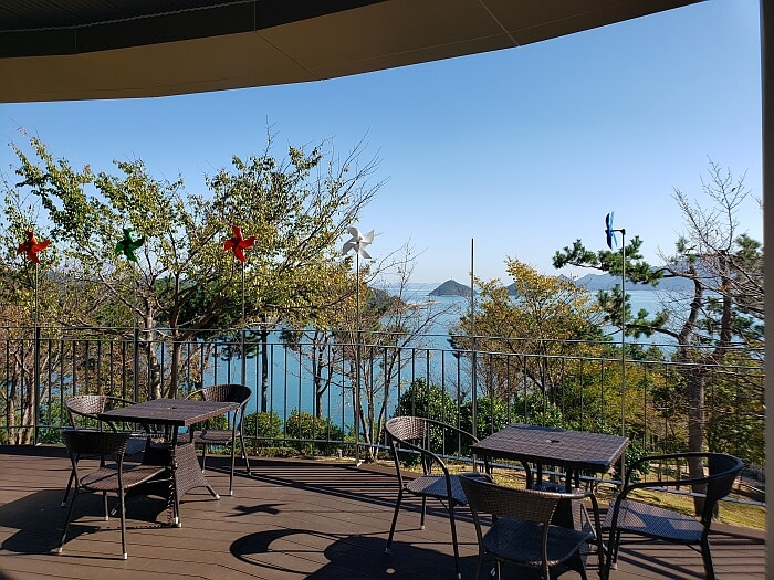 Tables and chairs outside at an observatory overlooking the sea