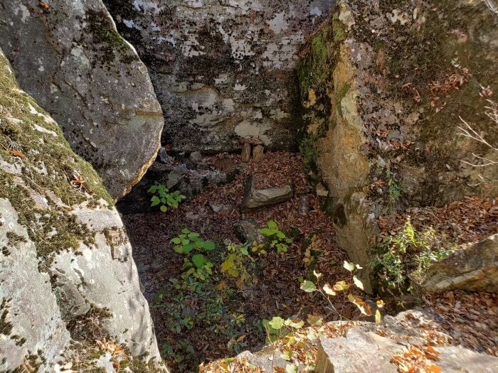 Looking down into the opening in the rock