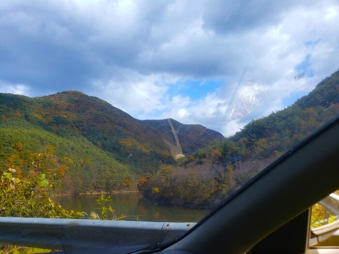 A reservoir along mountains in a provincial park in Korea