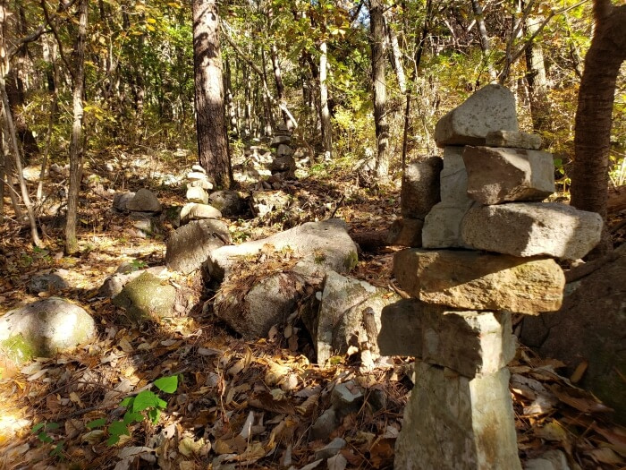 Rocks stacked along a path