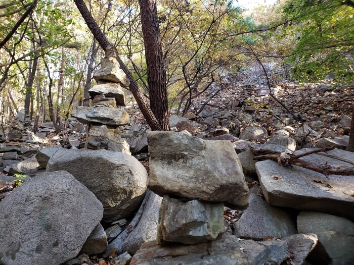 Rocks stacked along a rocky slope
