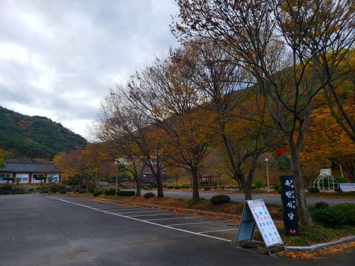 Buildings next to a large parking lot in Yeonhwasan Provincial Park