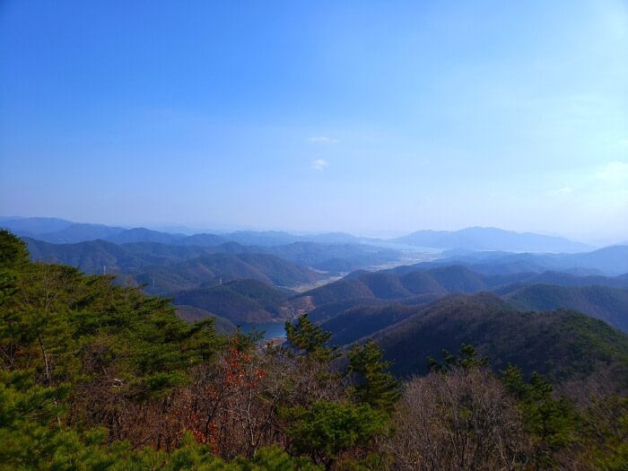 A view of mountains surrounding a reservoir near Wolgok Village in Goseong