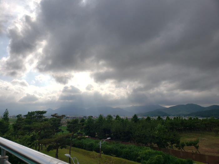 A view of mountains and clouds from the Goseong Ecology Learning Center's rooftop
