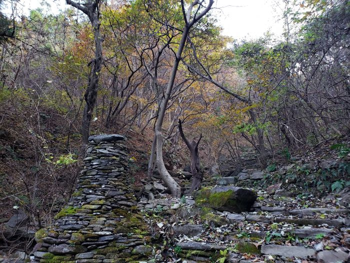Stacked rocks along a path at Odusan Healing Forest