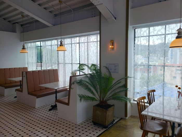 Booth seating against window at Table 154
