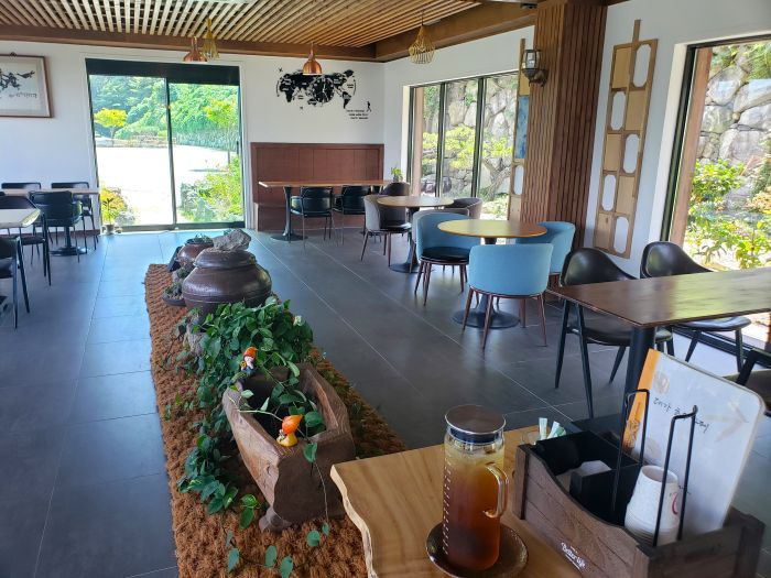 The interior of Daega Lake Café with carved wooden tables