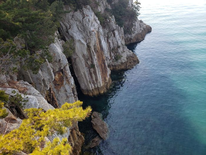 Rock formations on cliff along the water