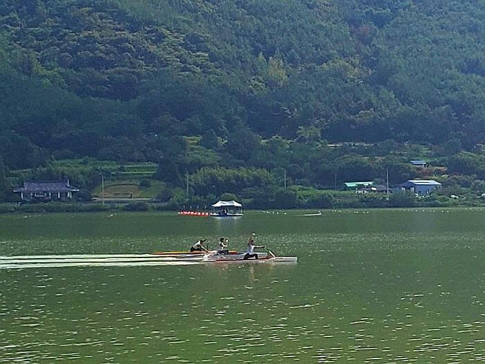 Kayakers in the water rowing and practicing strokes
