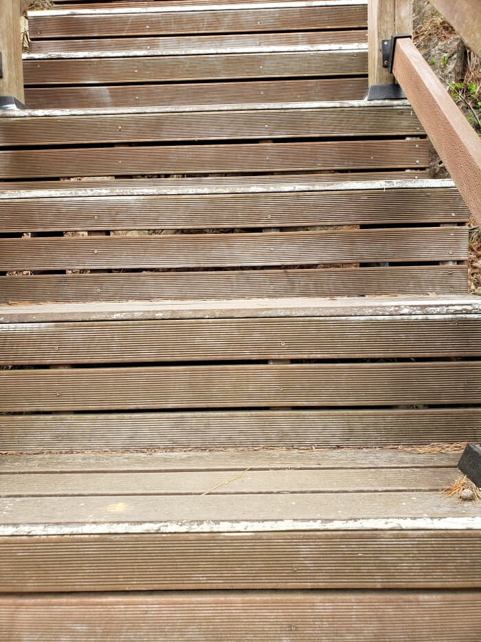 Looking straight ahead at the steep stairs with only a handful of stairs visible
