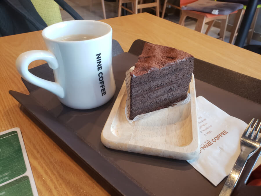Coffee and chocolate cake on a tray