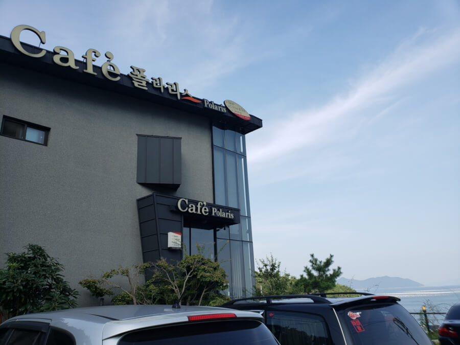 Building of cafe with water in background