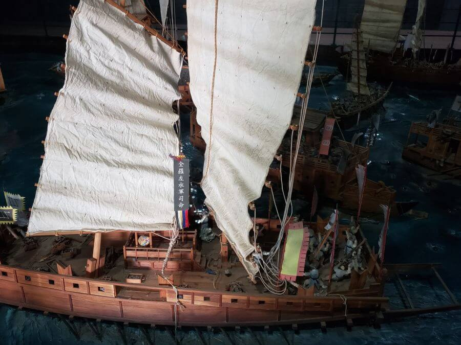 A closeup of a miniature warship model