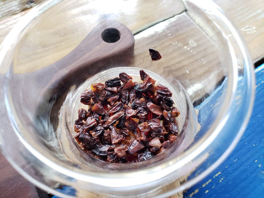 Goji berries in a glass after seeping in hot water