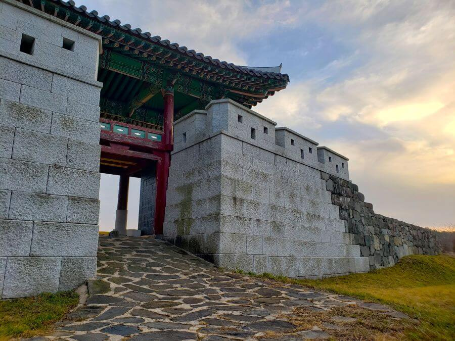 Stacked stone wall at the entrance to a fortress gate