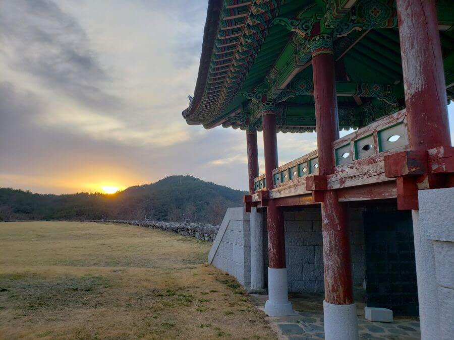 A wooden fortress gate at sunset