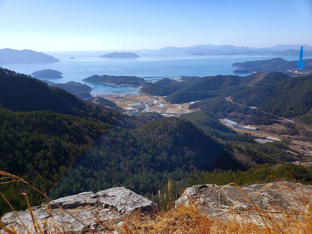 The Goseong Dinosaur Museum and Namhae visible from Jwaisan mountain in Goseong