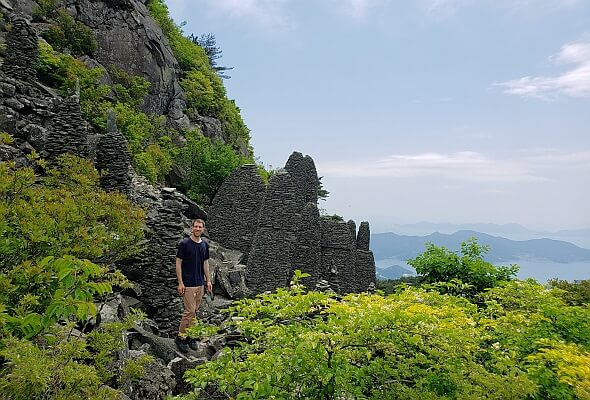Byeogbangsan Mountain with Nate standing next to rock structures